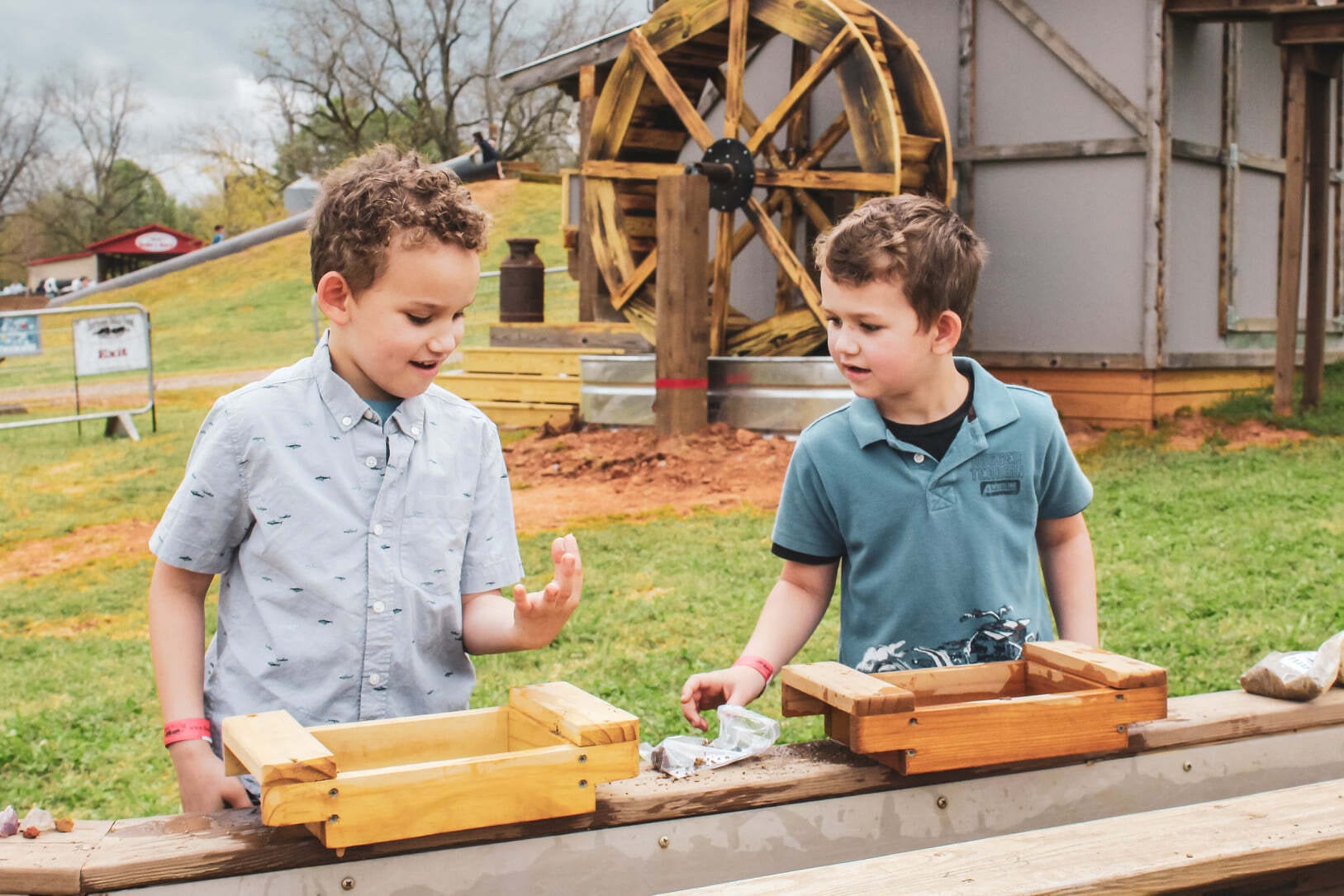 2 boys playing at a gem mining activity