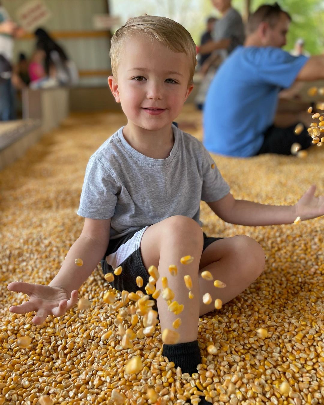 Boy playing with corn